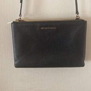 Michael lots, black leather, gold hardware, adjustable crocs body bag